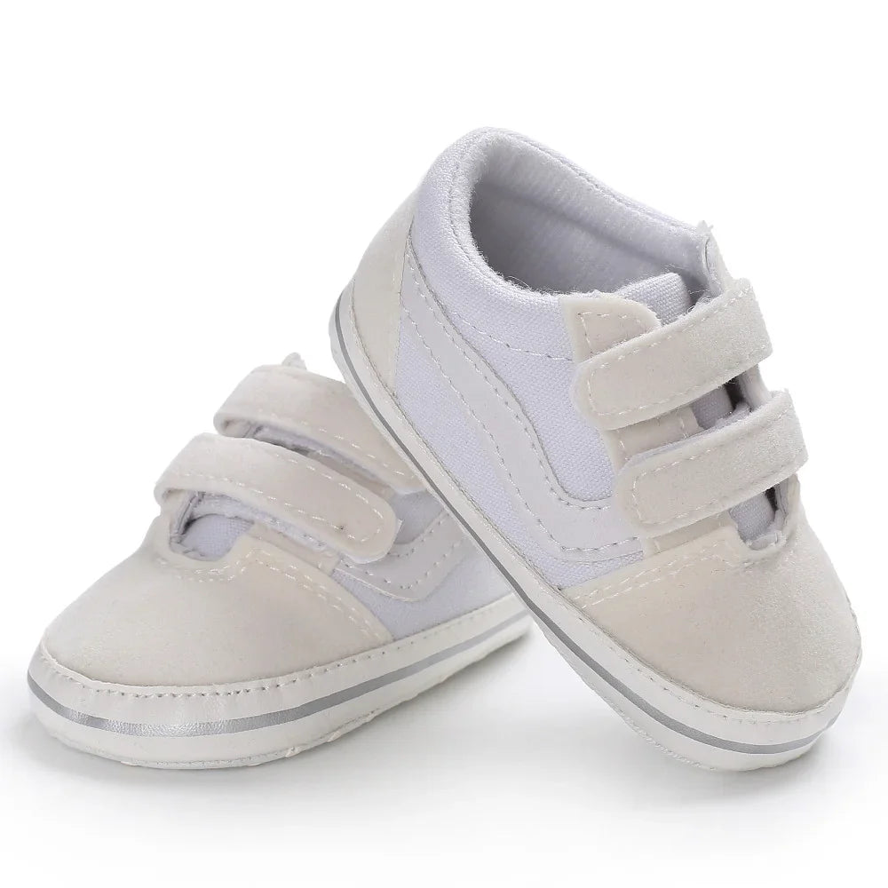 Soft sole infant shoes, unisex design, ideal canvas first walkers for developing feet.