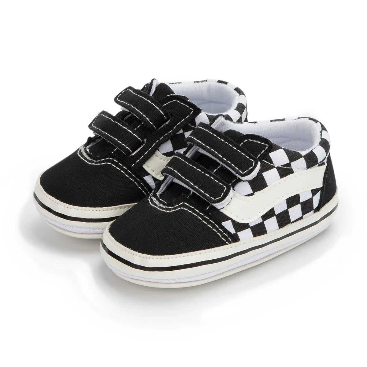 Easy-to-wear unisex infant canvas shoes with hook and loop fasteners and soft sole.
