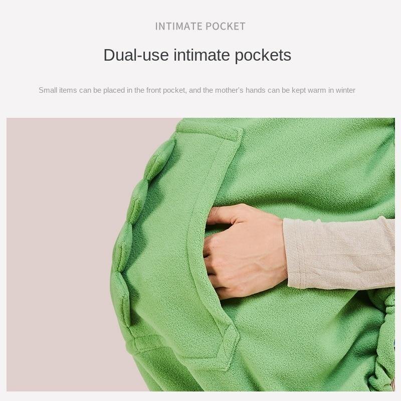 Green dinosaur winter baby carrier hoodie, warm infant cover for outdoor baby gear & stroller use.