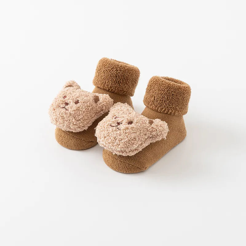 Close-up of anti-slip sole on cartoon bear baby winter socks, cotton blend