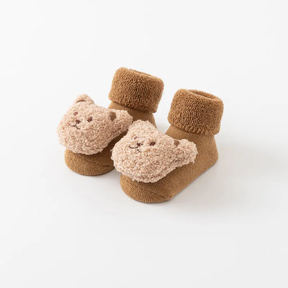Close-up of anti-slip sole on cartoon bear baby winter socks, cotton blend