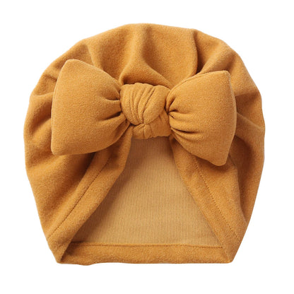 Cashmere-like baby hat with a charming bow tie, comfortable and stylish for newborns