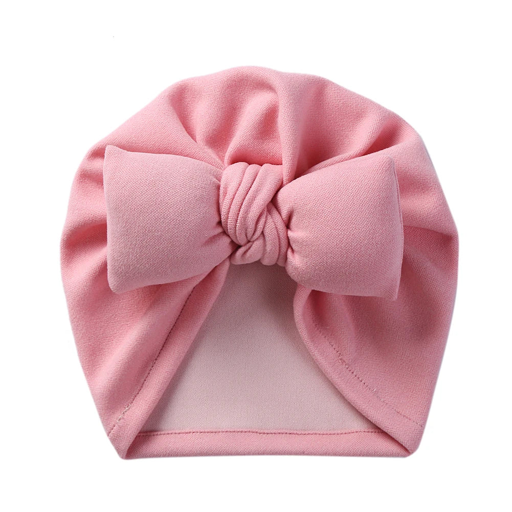 Neutral-colored cashmere-like baby bow bonnet, versatile unisex topknot hat for infants