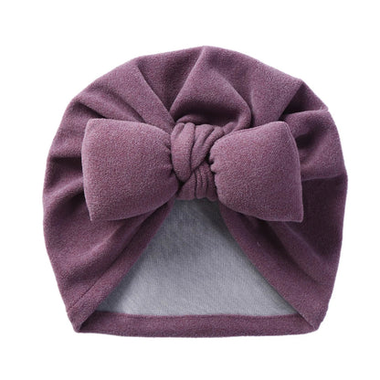 Unisex infant accessory: Cashmere-like bow topknot bonnet, designed for warmth and style