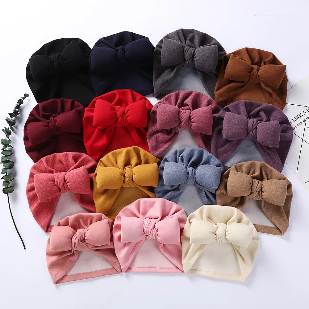 Unisex infant headwear: cashmere-like bow topknot bonnet for warmth and comfort