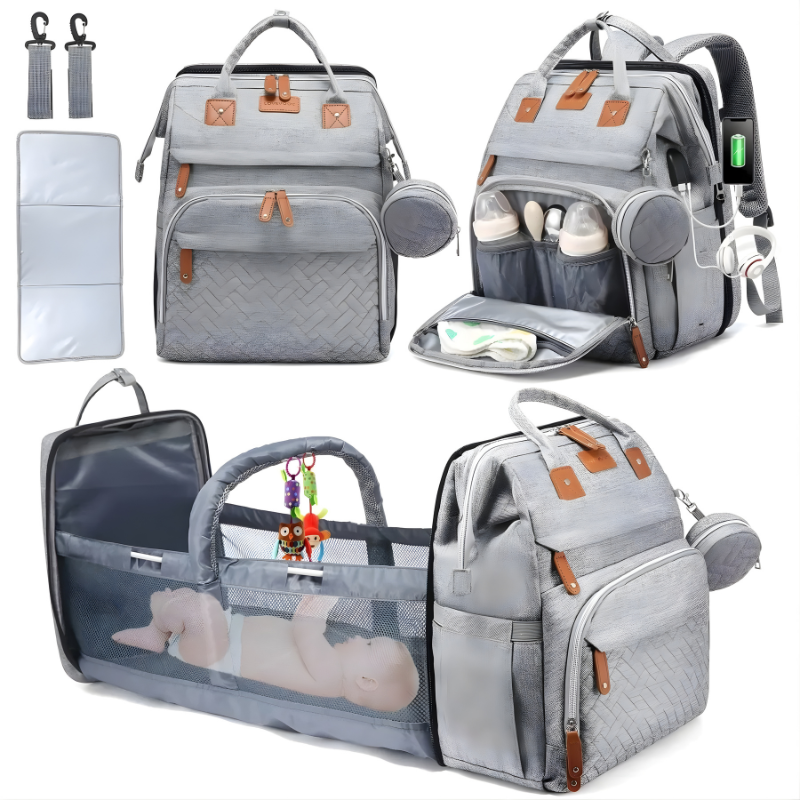 Interior view of a large baby changing backpack, organized with mesh pockets & including a foldable changing mat