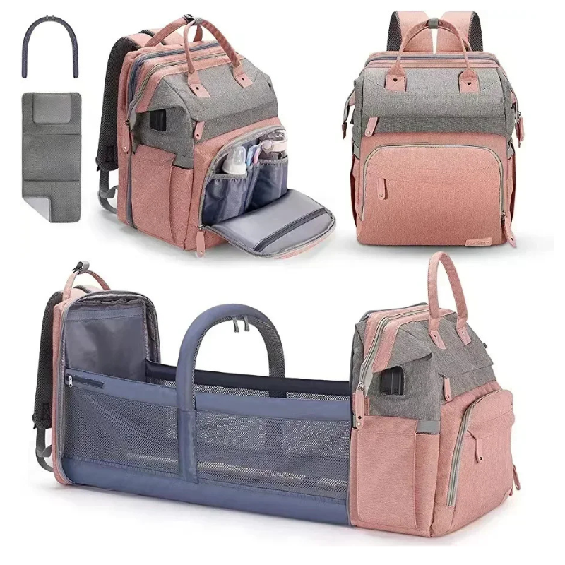 Close-up of the durable, easy-to-clean fabric of a unisex baby changing backpack, showcasing quality zippers