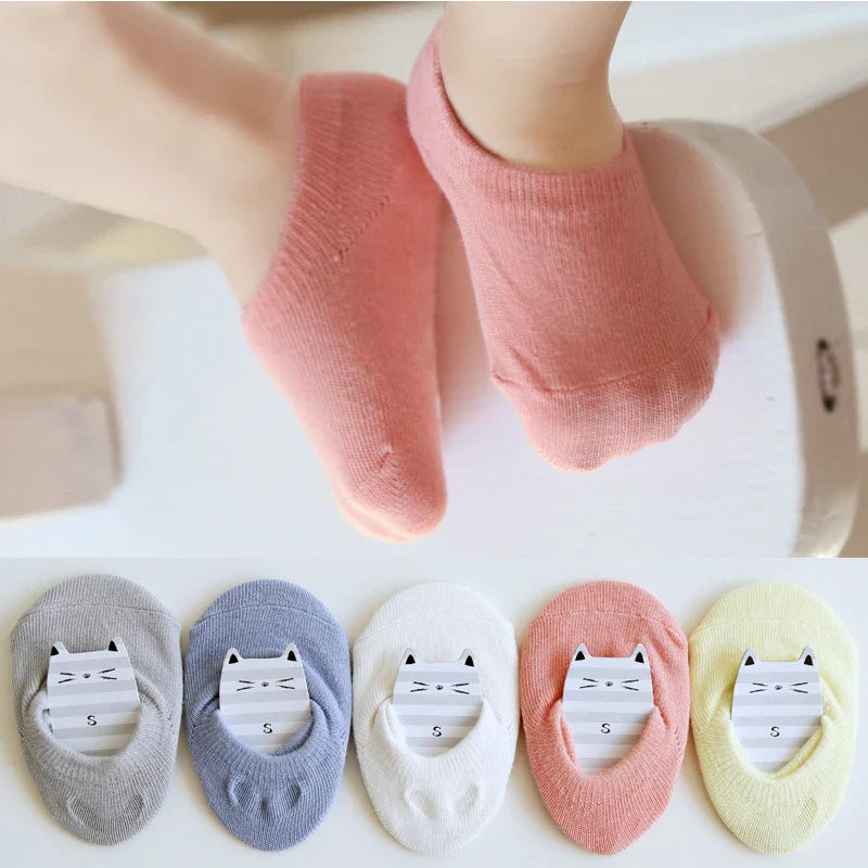 Durable anti-slip ankle socks for infants, providing grip on smooth surfaces like wood floors