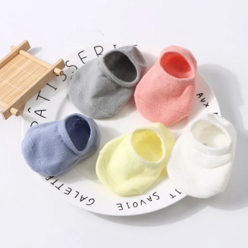 Gender-neutral cotton anti-slip baby socks, available in various sizes for growing feet
