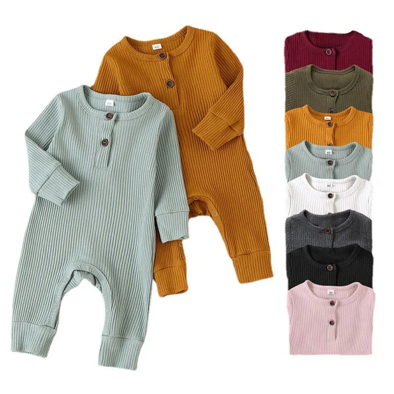 Unisex baby cotton long sleeve romper in a playful print, perfect for autumn comfort and style.