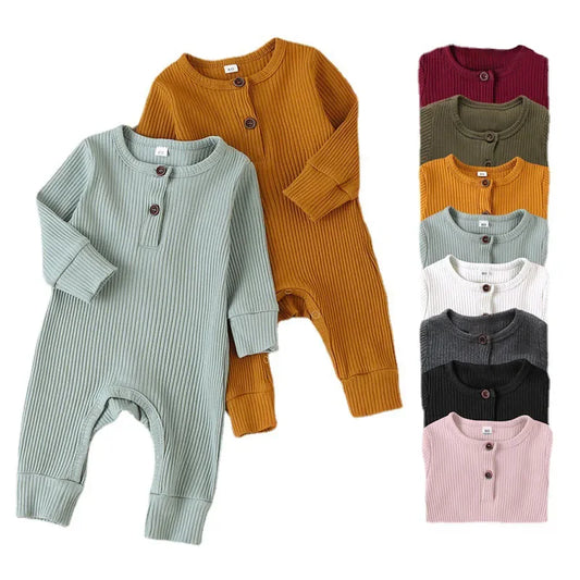 Unisex baby cotton long sleeve romper in a playful print, perfect for autumn comfort and style.