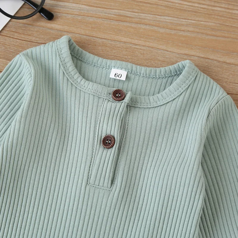 Soft cotton long sleeve jumpsuit for babies, unisex design, ideal for autumn and spring layering.