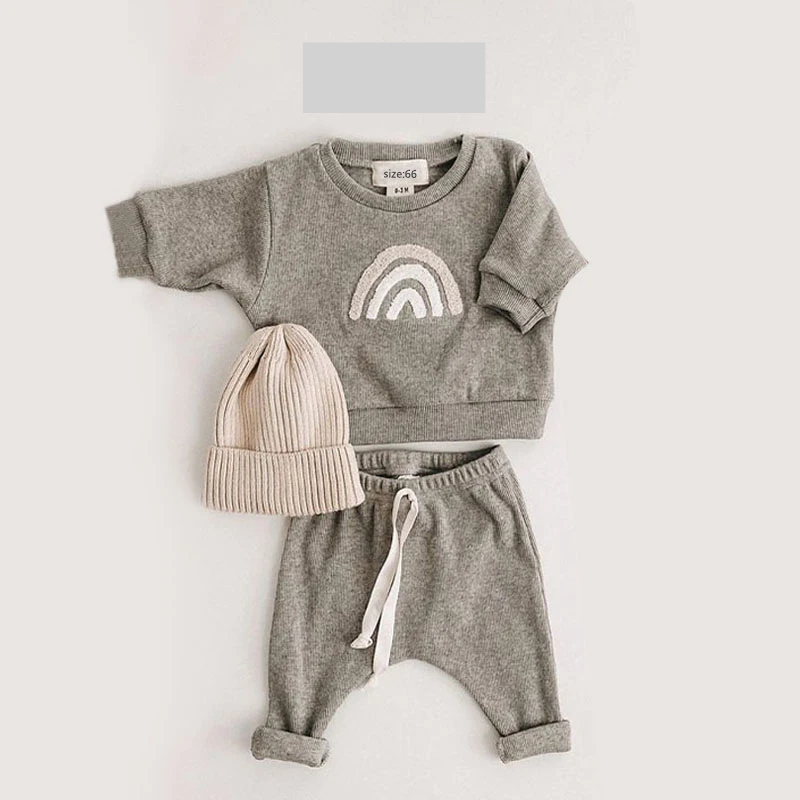 Unisex baby cotton ribbed outfit with elastic waistband, providing comfortable fit for toddlers and infants