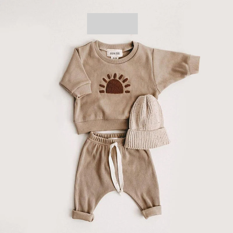 Unisex baby cotton ribbed top with snap closures, easy wear design for quick changes, soft infant apparel