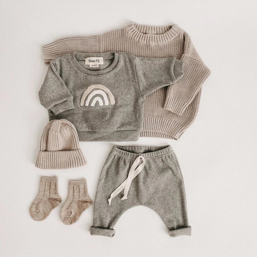 Close-up of unisex baby cotton ribbed set, featuring soft fabric and flexible design for infant comfort