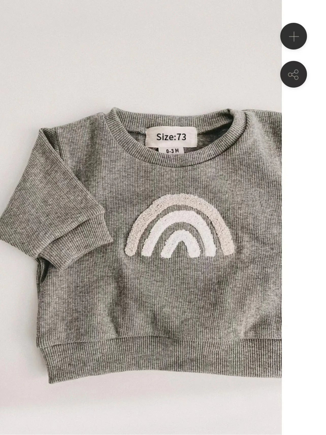 Baby modeling unisex cotton ribbed clothing set in a neutral color, perfect for fall and spring attire