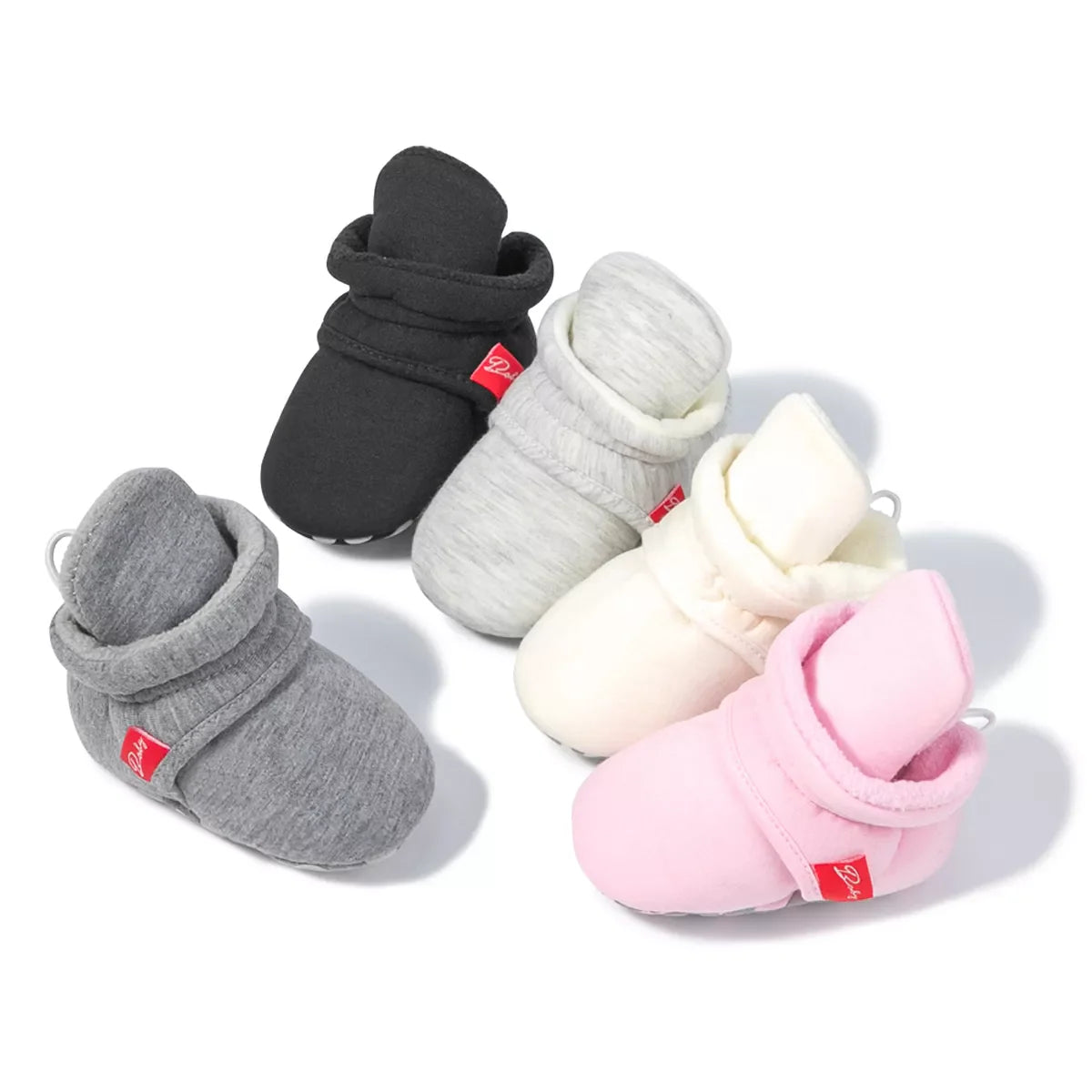 Unisex baby cotton soft sole first walker sock shoes with anti-slip grip on wood floor.