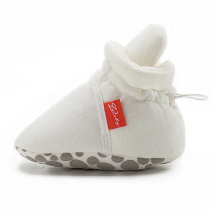 Infant footwear: unisex baby soft sole first walker sock shoes in light blue.