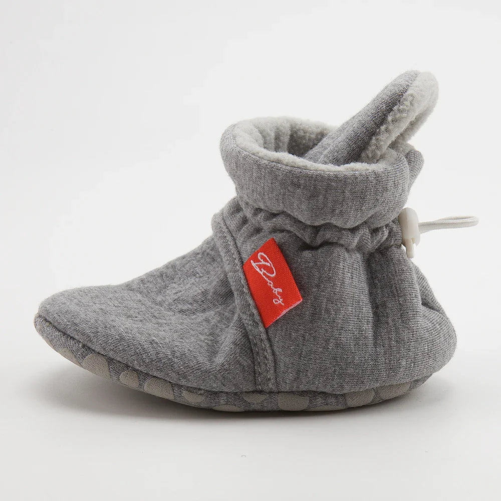 Unisex baby first walker sock shoes with reinforced toe for durability.