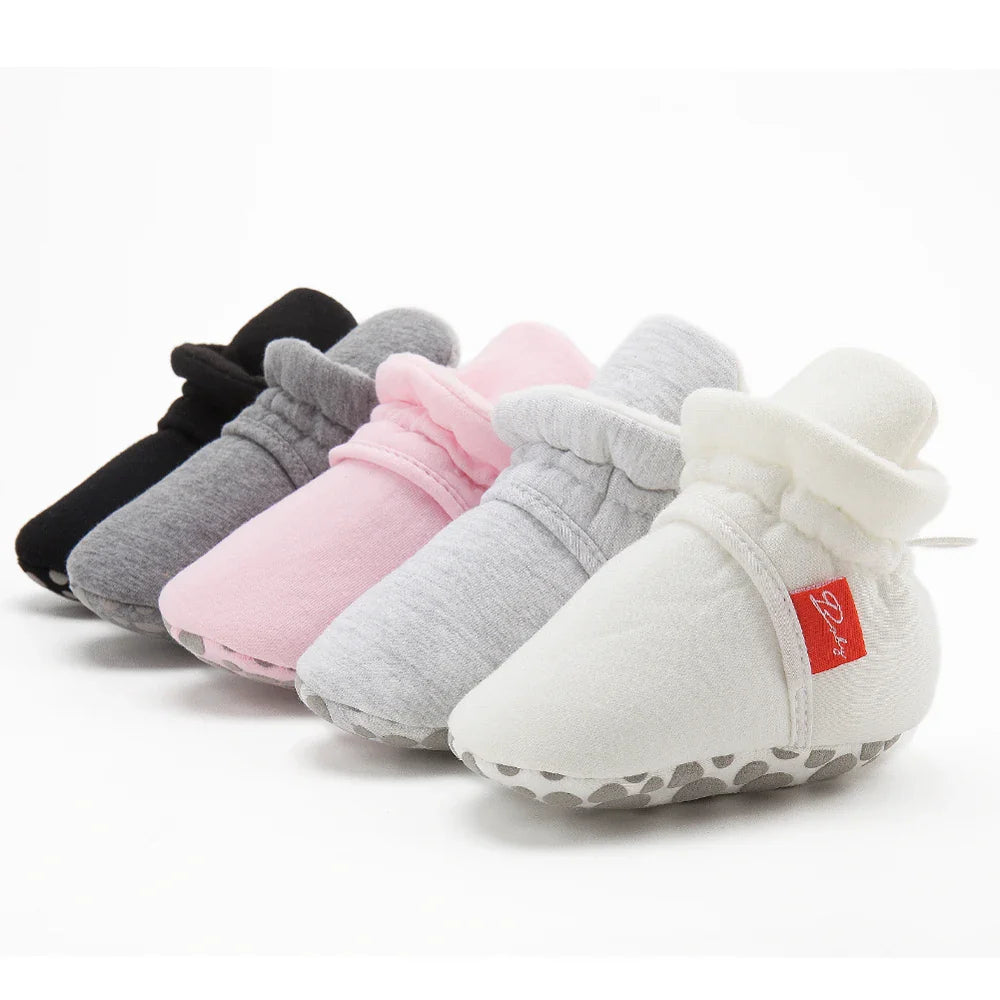 Perspective view of unisex baby cotton soft sole first walker sock shoes.