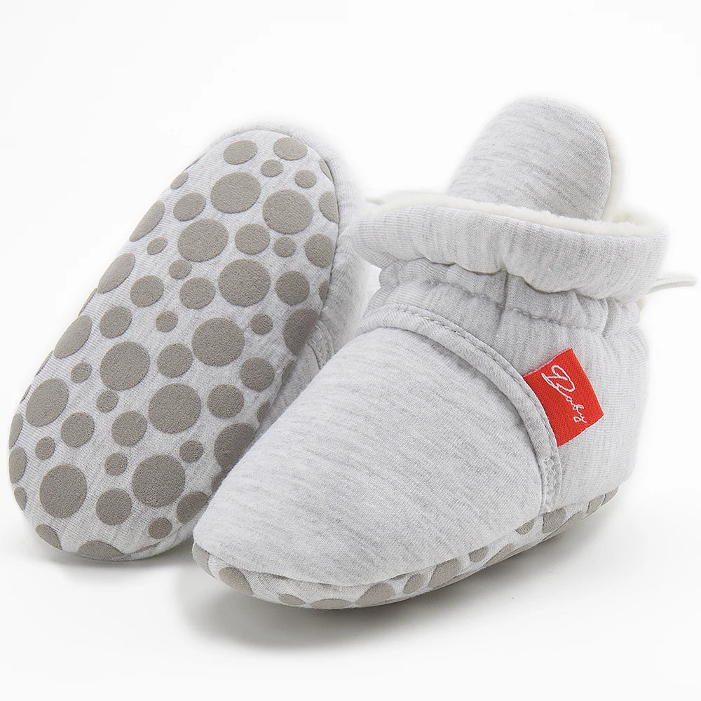 Unisex baby first walker sock shoes with a cute animal face design on fabric.