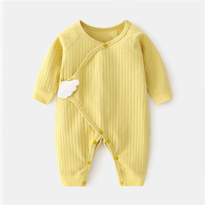 Side view of baby crawling in a cotton romper, showing freedom of movement for infants
