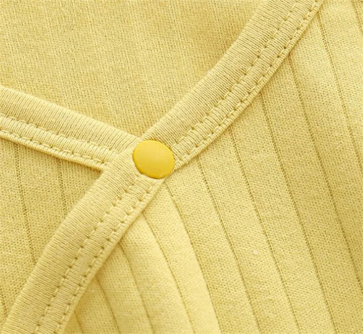 Infant jumpsuit in a cozy setting, perfect autumn infant wear for warmth and style