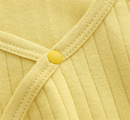 Infant jumpsuit in a cozy setting, perfect autumn infant wear for warmth and style
