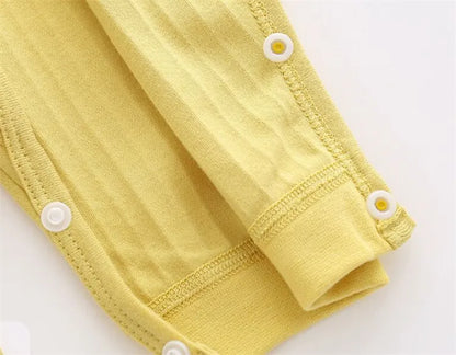 Collection of solid color infant rompers, offering versatile choices for unisex baby fashion