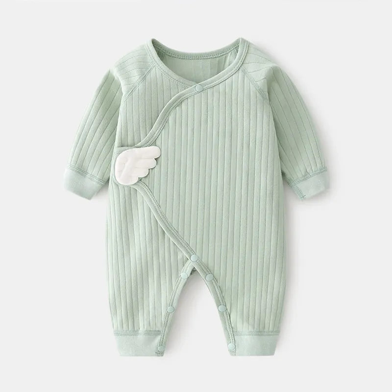 Close-up of cotton baby romper fabric, demonstrating soft texture for infant's skin