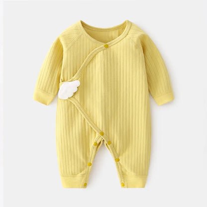 Baby wearing solid cotton romper, looking comfortable and cute in this newborn outfit