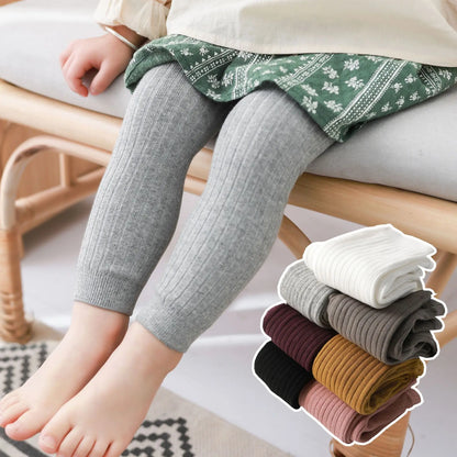 Toddler in comfortable grey cotton stretch leggings, ideal for everyday play, unisex baby wear