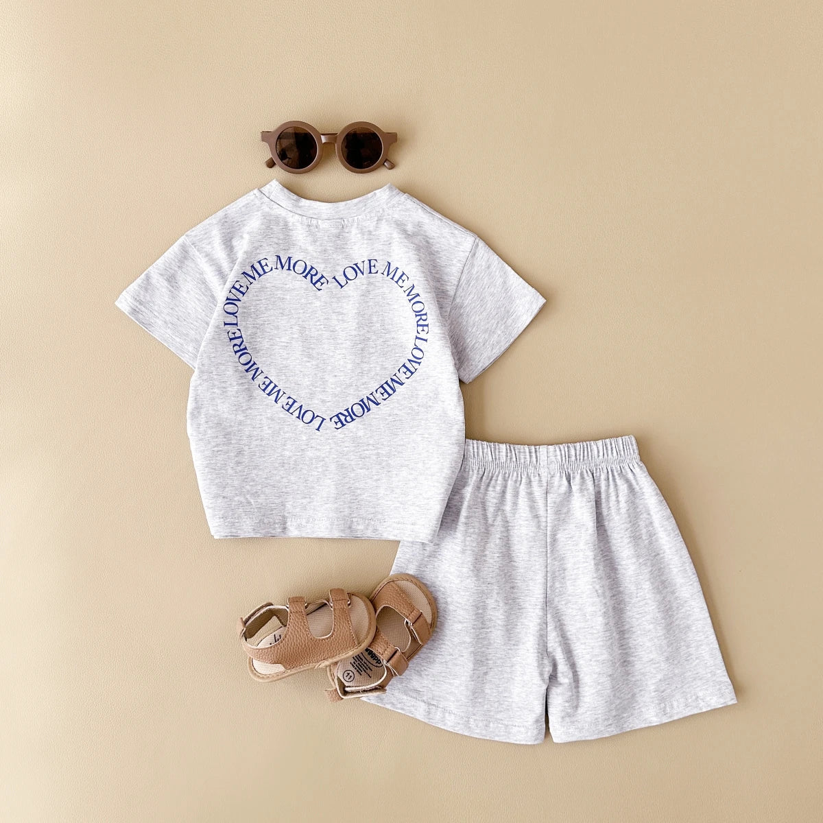 Cute gender-neutral baby summer outfit, cotton t-shirt and shorts combo for infants