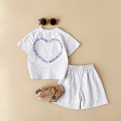 Cute gender-neutral baby summer outfit, cotton t-shirt and shorts combo for infants