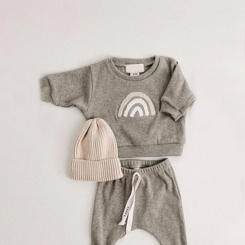 Adorable unisex baby fall clothes, including a striped long-sleeve shirt and solid pants.