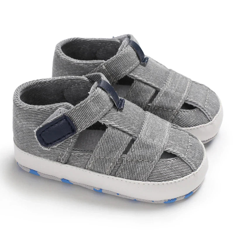 Unisex baby fashion: Blue canvas first walker shoes with anti-slip sole for growing feet.