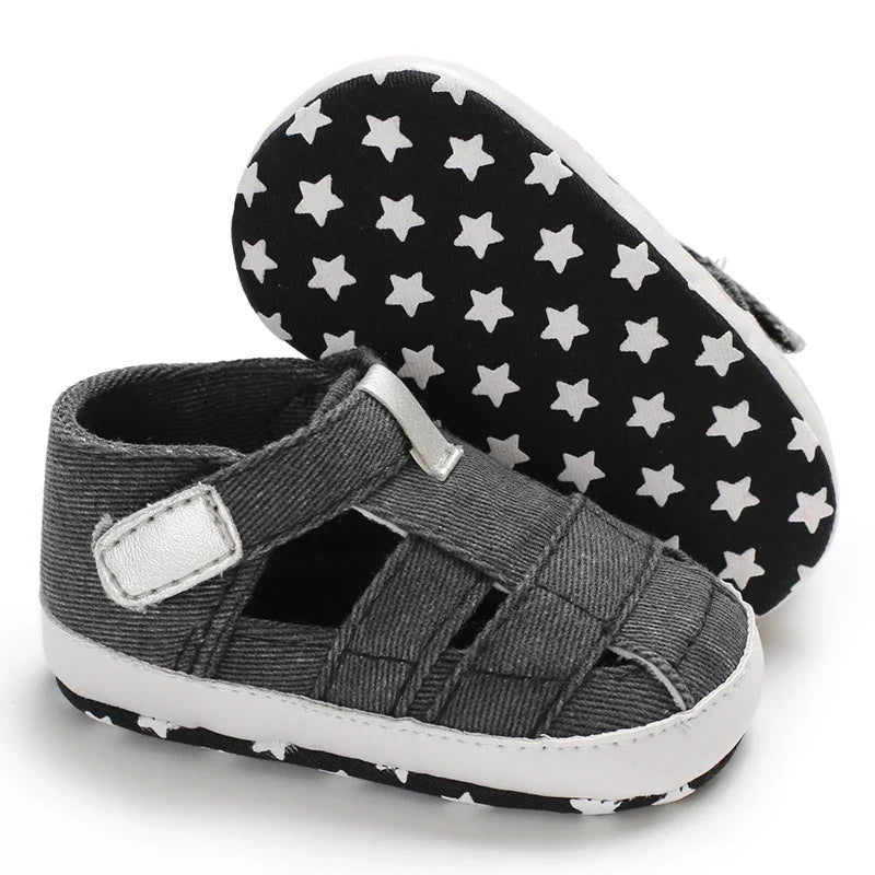 Classic black canvas first walker shoes for baby, soft sole, anti-slip, unisex design.