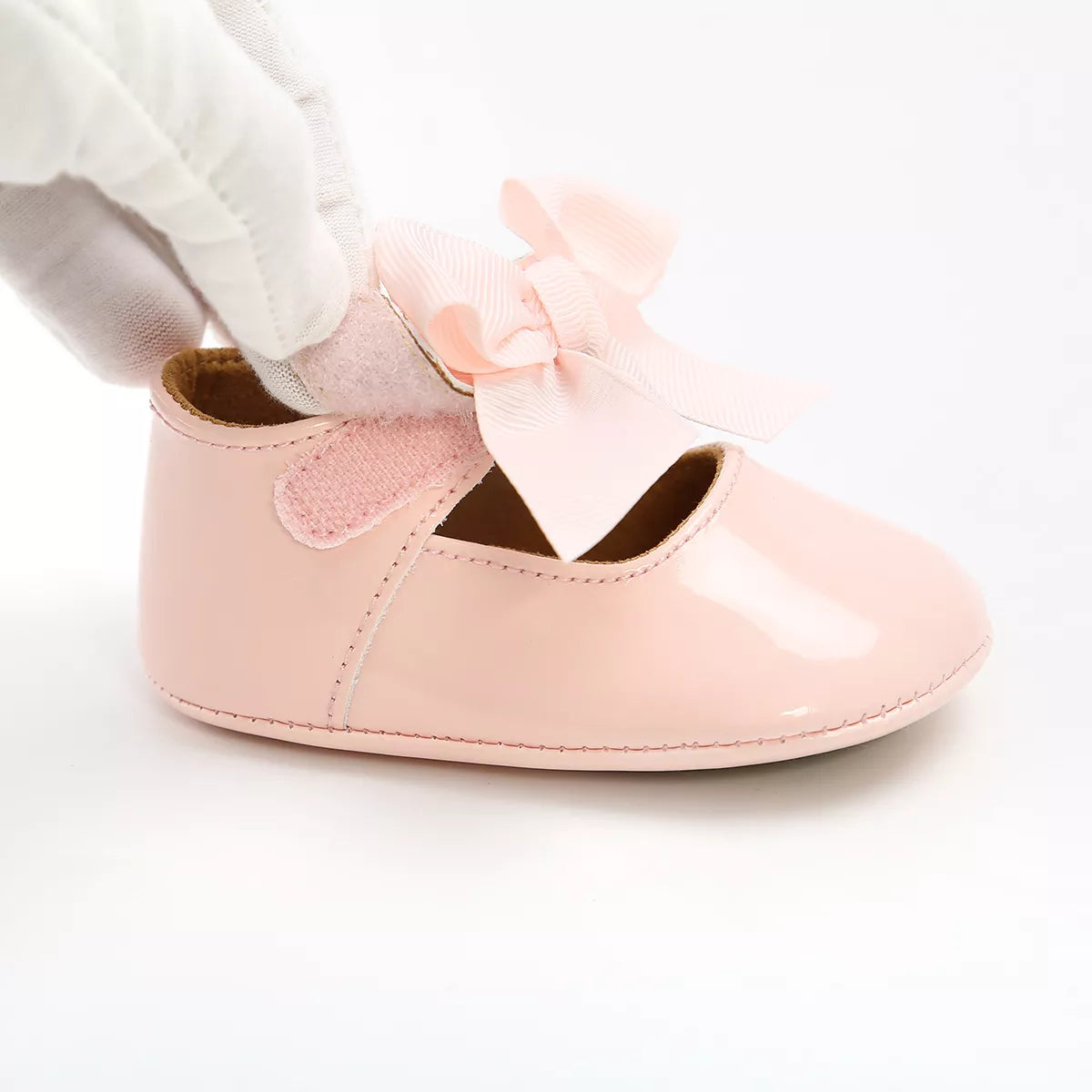Casual white infant anti-slip first walker shoes, soft sole, unisex design for comfortable baby movement