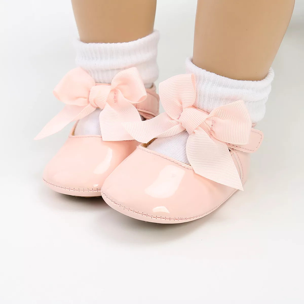 Stylish white anti-slip baby first walker shoes, unisex design, soft PU leather for newborn comfort