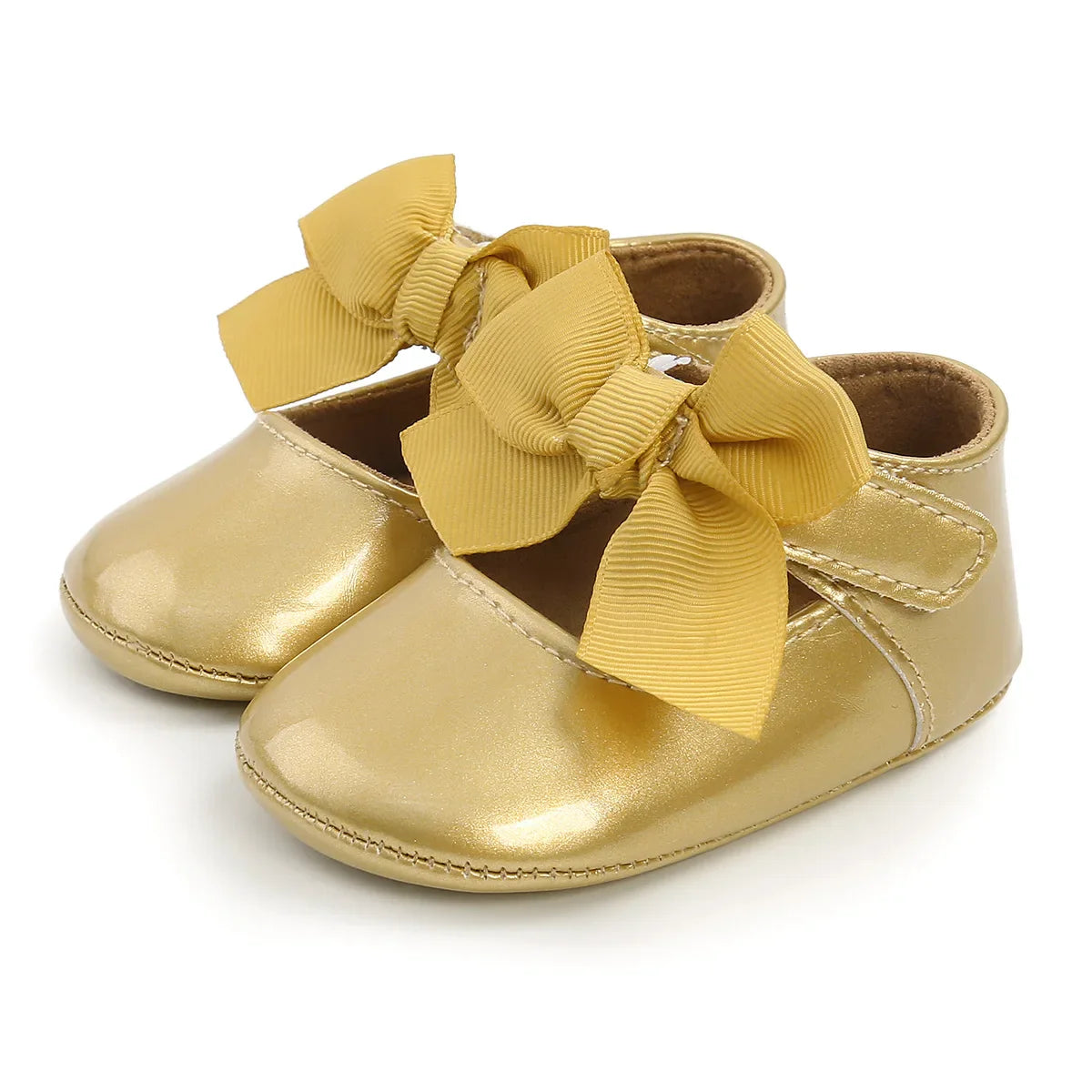 Close-up of the pristine white PU leather on unisex anti-slip baby first walker shoes, soft and durable