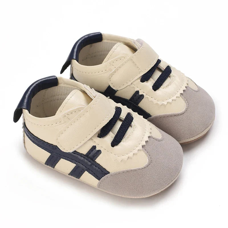 Soft sole baby first walker sneakers, anti-slip design for secure steps.