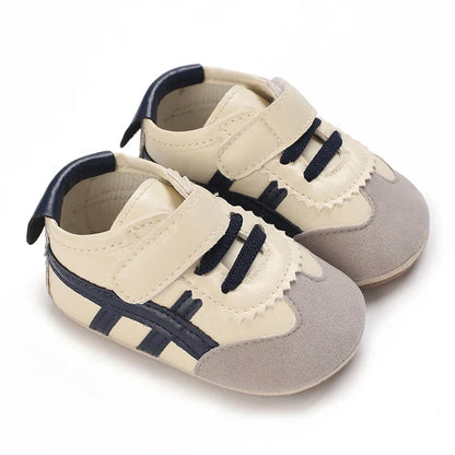 Soft sole baby first walker sneakers, anti-slip design for secure steps.