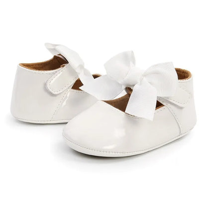 Side view of infant anti-slip first walker shoes, unisex design, durable white PU leather, all season