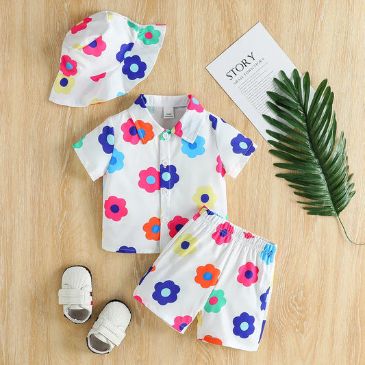 Unisex baby floral summer outfit set with short-sleeve romper, shorts, and matching hat on white background