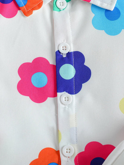 Detail shot of the soft fabric and floral pattern of the unisex baby summer romper and matching hat