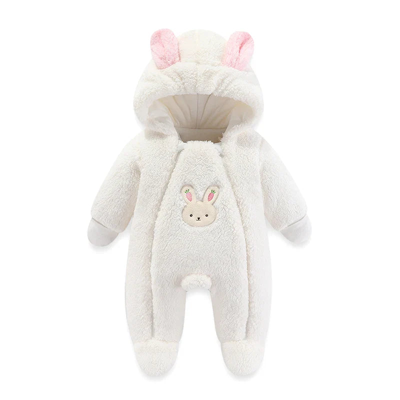 Baby's joyful face peeking from a cozy cartoon hooded winter romper