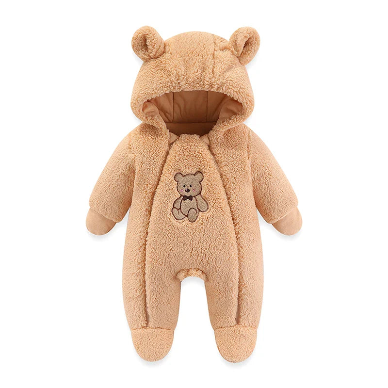 Back view of a baby in a comfortable, hooded, cartoon winter romper