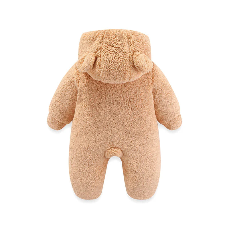 Side profile of a baby wearing a warm cartoon hooded jumpsuit, winter essential