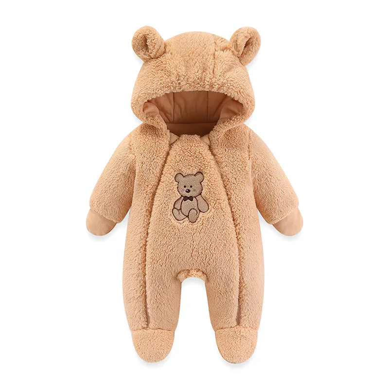 Baby crawling in a warm, hooded, cartoon-style romper made of soft fabric