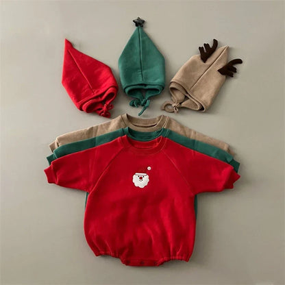 Detailed view of the white trim and buttons on a unisex baby Christmas Santa romper.